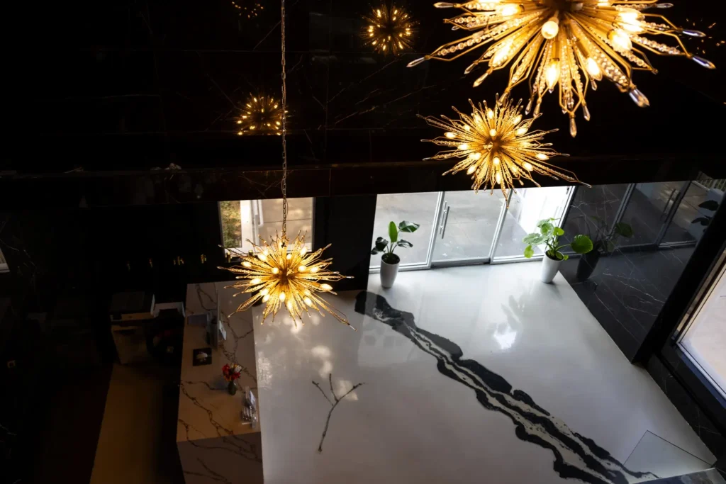 Dallas luxury venue - Imagen's entrance with stunning chandeliers and sleek glass door