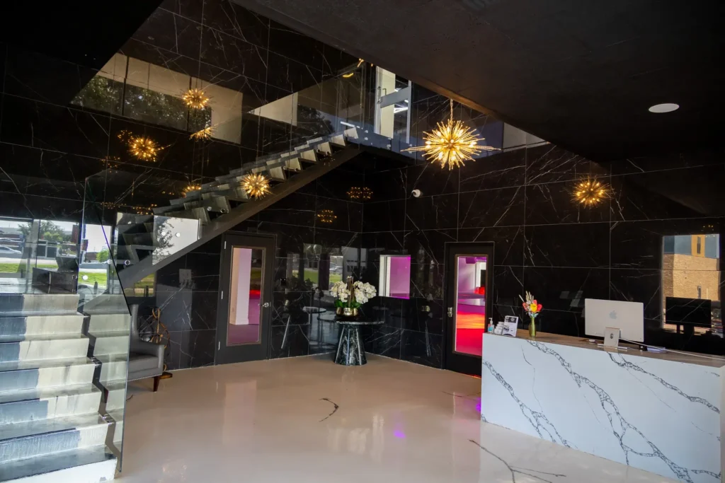 Sleek glass staircase at Imagen Venues Dallas, a blend of modern design and sophistication
