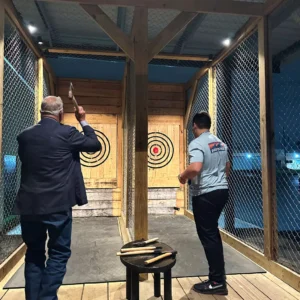 Guests throwing axes at Imagen Venues corporate event venue in Houston