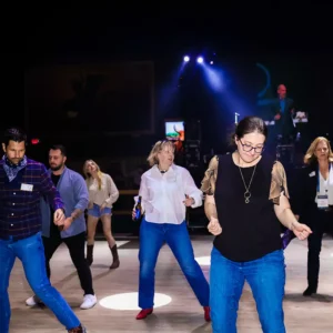 Guests line dancing at Imagen Venues, a corporate event venue in Houston