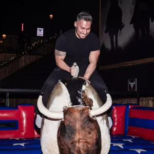 Guest riding the mechanical bull at Imagen Venues corporate event venue in Houston