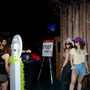 Guests posing at the photo booth during a corporate event at Imagen Venues in Houston