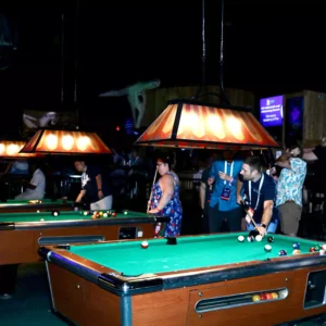 Guests playing pool at Stampede inside Imagen Venues, a seamless corporate event venue in Houston
