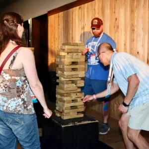 Guests playing giant Jenga at Imagen Venues corporate event venue in Houston