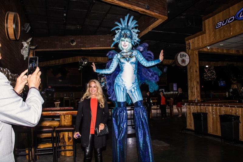 Costumed stilt walker entertaining guests at Stampede Event Center
